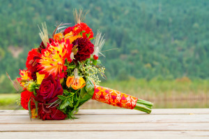 Fall themed wedding bouquet on a cabin porch